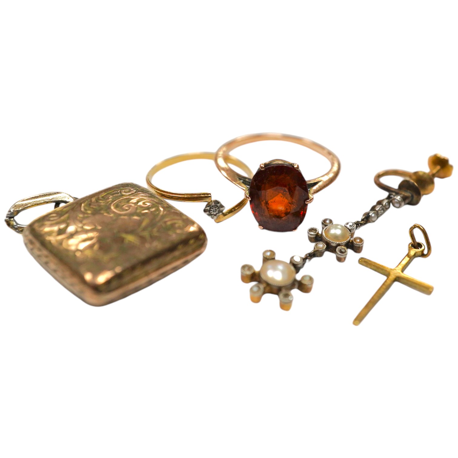 Sundry jewellery including a yellow metal and hessonite garnet set ring, a single yellow metal, seed pearl and diamond cluster set drop earring, locket, cross and a ring. Condition - poor to fair